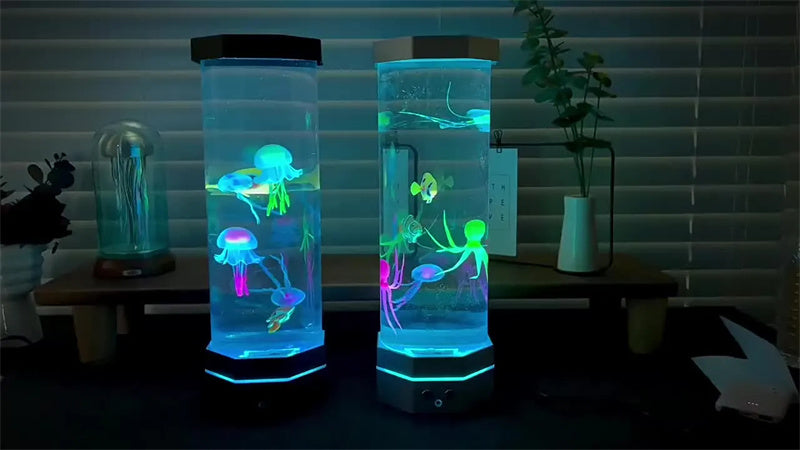 Two jellyfish lamps glowing in a dark room