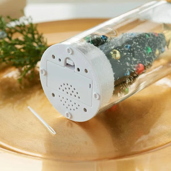 Underside of the snowy base showing the built-in voice recorder speaker and battery cover