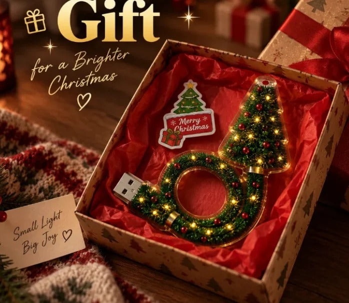 Tree projector lamp in a red gift box with a Merry Christmas tag