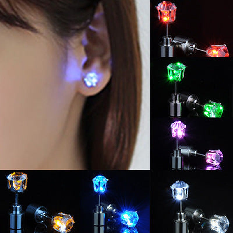 Woman wearing a glowing LED stud earring, with blue, red, green, pink, orange and white earrings