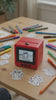 8-second demo — press the button, the AI draws your idea, and it prints a sticker to color in