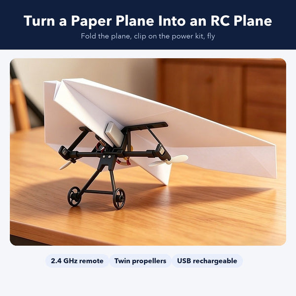 Remote control paper airplane kit with twin propellers and landing gear on a table