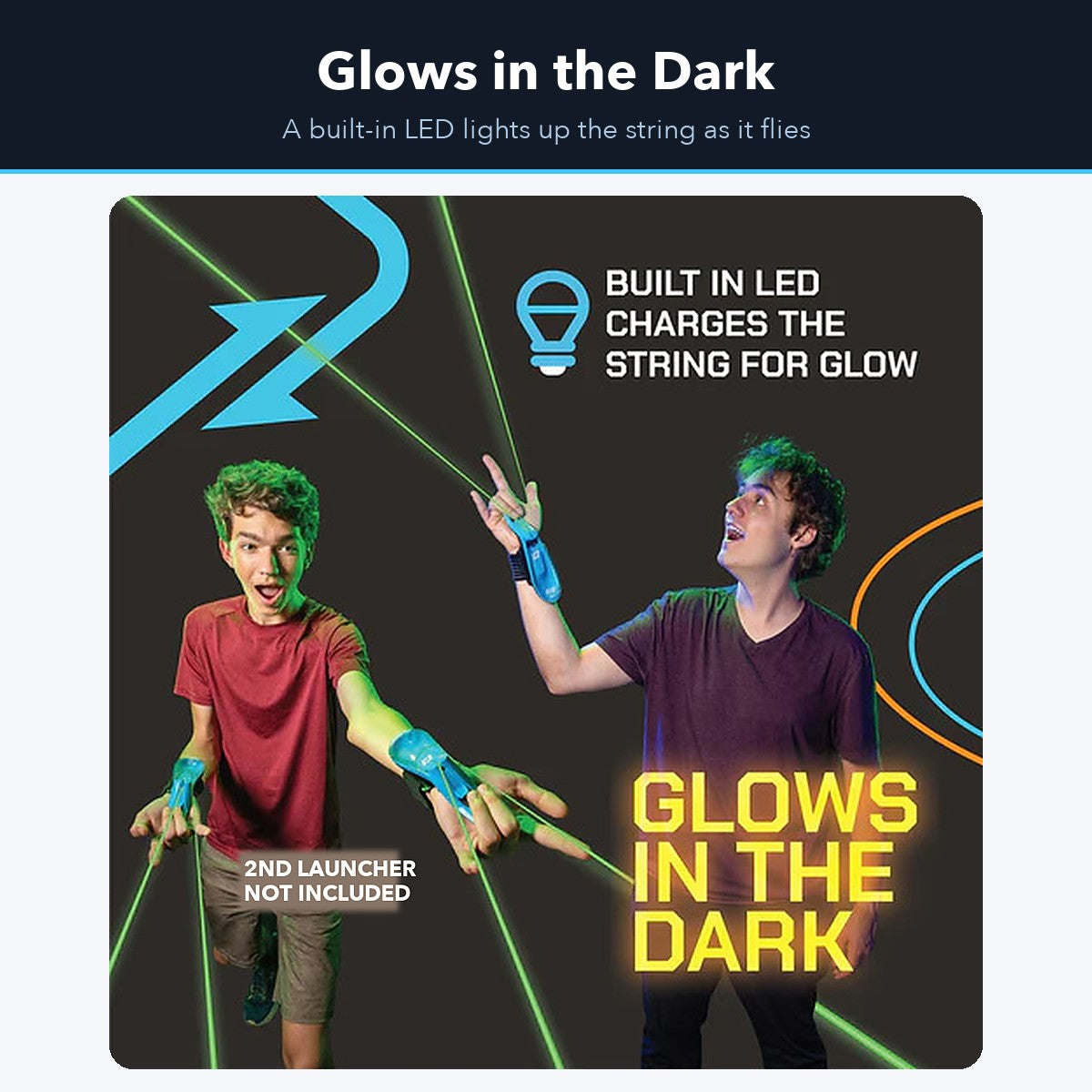 Two teenagers playing with glowing strings from wrist launchers in a dark room