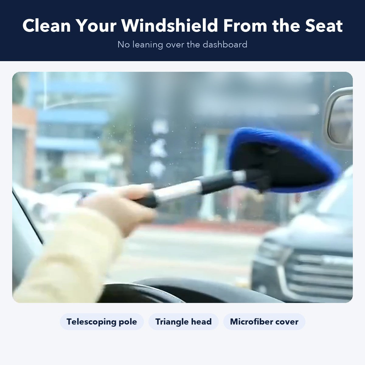 Wiping the inside of the windshield from the driver seat with the extendable cleaner